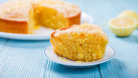Cake with Lemon and Coconut.Homemade Cakes on a Blue Background.Copy space for Text. selective...