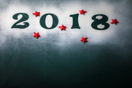 Christmas and New Year Background Green colour Wooden Figures 2018 Holiday Symbol Snow Traditional Decoration Christmas tree Stars Top View Copy space for Textの写真素材