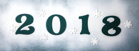 Christmas and New Year Background Green colour Wooden Figures 2018 Holiday Symbol Snow Top View Copy space for Textの写真素材