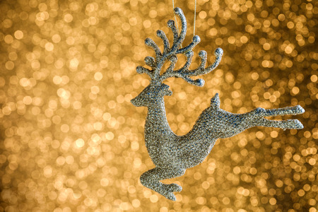  Defocused Abstract Blurred Shiny Christmas Background with Sparkles Golden Deer   Decoration Happy New Year  Festive Holiday  with Light Effect Boke Space for text Selective focusの写真素材