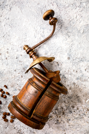 Coffee grinder Hand Vintage with roasted coffee beans.Wooden on a gray background. Top View.Copy space for Text.の写真素材