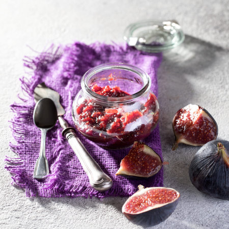 GÐ°m from the fig in a glass jar. Dessert sweet confiture.selective focus.の写真素材