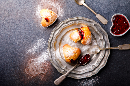 Muffins with Raspberry Jam. Sweet Home-made pastries on a dark background.Copy space for Text. Top View.の写真素材