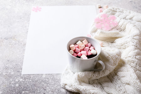 Creative winter natural composition  cup of hot chocolate and marshmallows, with decoration pink...