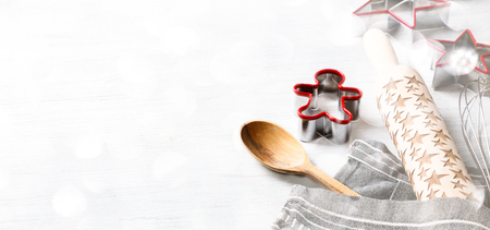 Kitchen apron on Holiday Background Concept of Christmas and New Year. Festive  Baking. Poster design, rolling and whisk, a wooden spoon and cookie cutters and gingerbread. Copy space for Text.の写真素材