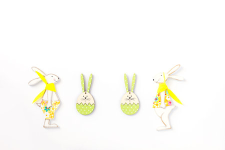 Easter background. Traditional eggs and rabbit. Festive decoration isolated on white.Copy space for...