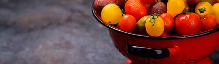 Cherry tomatoes. Summer useful vegetable for vegetarians. Variety of colors and tastes.の写真素材