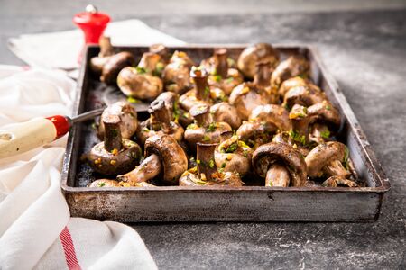 Baked champignons. Mushrooms in sauce. Hot appetizer. Fried vegetables.の写真素材