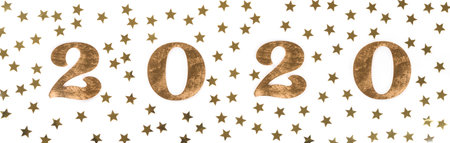 Happy New Year 2020 . Festive Shining starry composition on isolated white background with wooden...
