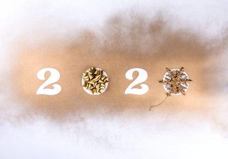 Happy New Year 2020 . Festive Shining  composition on  gold background .Flat lay, top view, copy...