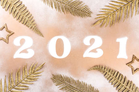 New Year Flat Lay composition Shining Holiday card with Holiday card with numbers 2021 Celebration on a gold background. Holiday party decoration.Flat lay, top view, copy space.の写真素材