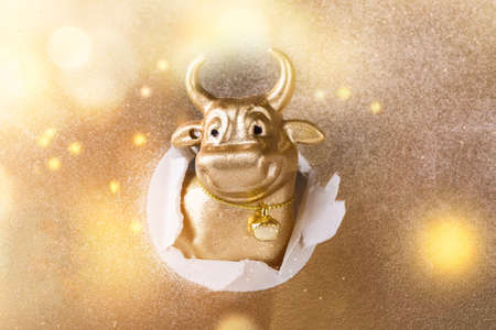 Greeting card Happy New Year metal bull. Christmas traditional holiday.Light Effect Bokeの写真素材