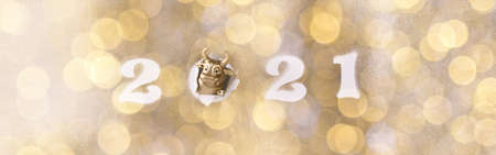 Greeting card Happy New Year metal bull. Christmas traditional holiday.Light Effect Boke.Banner Panoramaの写真素材