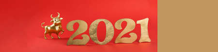 Metallic Gold Bull Red Background Symbol 2021 New Year.Holiday postcard.Copy space.の写真素材