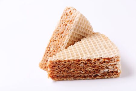 Sweet waffle cakes on white background. Two slicesの写真素材