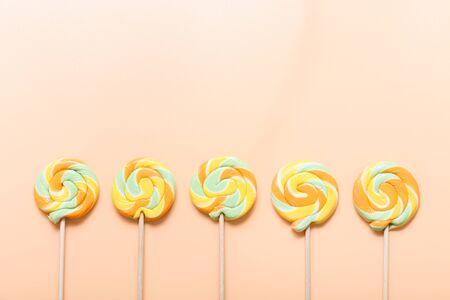 Colorful lollipops on color backgroundの写真素材