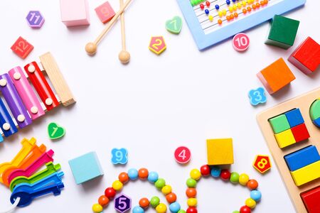 Frame of colorful kids toys on white background. Top view, flat lay.の写真素材