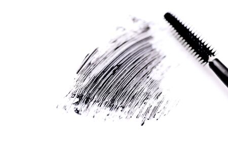 Mascara brush with mascara stroke on white backgroundの写真素材