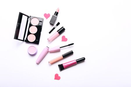 Make-up products on white background, top view with copy spaceの写真素材