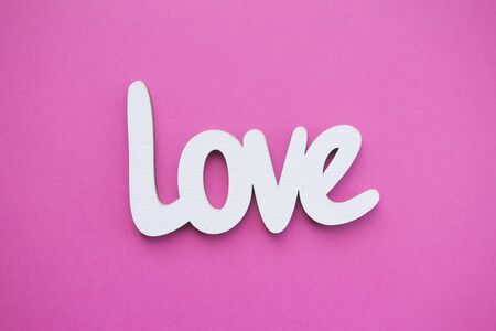Word Love on bright pink background, top viewの写真素材