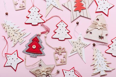 Christmas wooden decorations on pink backgroundの写真素材