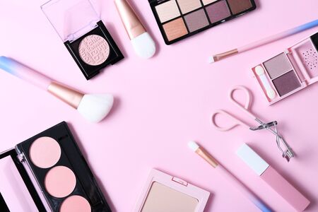 Make-up products on pink background, top viewの写真素材