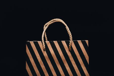 Shopping bag on black background, close upの写真素材