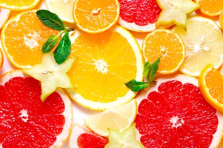 Citrus background. Sliced orange, grapefruit, lemon and tangerines, close upの写真素材