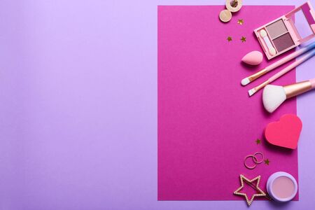Set of professional decorative cosmetics, makeup tools and accessory on colorful background. Beauty, fashion and shopping concept. Flat lay composition, top viewの写真素材