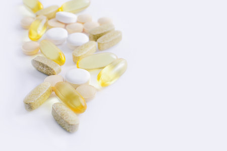 Assorted pharmaceutical medicine vitamins, pills, drugs on white background