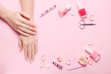Different tools for manicure on pink background, top viewの写真素材