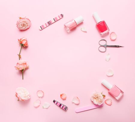 Different tools for manicure on pink background, top viewの写真素材