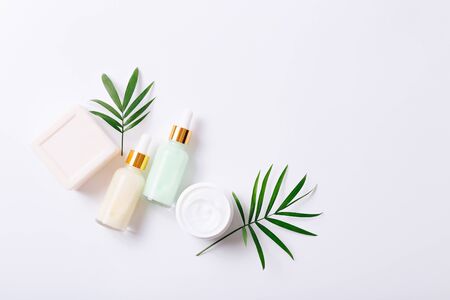 Herbal dermatology cosmetic products and cream on white background. Copy spaceの写真素材