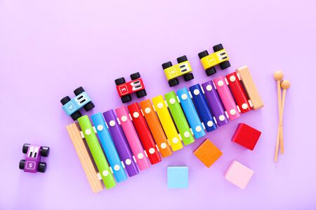 Colorful kids toys on purple background. Top viewの写真素材