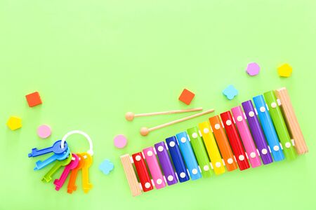 Colorful kids toys on green background. Top viewの写真素材