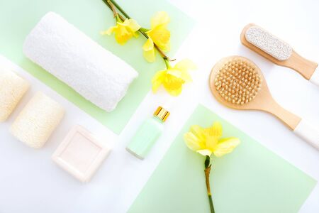 Bath Accessories on white and green background, flat layの写真素材