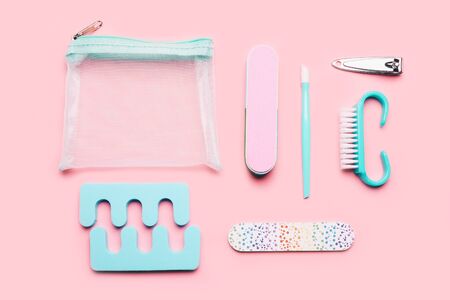 Pedicure set on light pink backgroundの写真素材