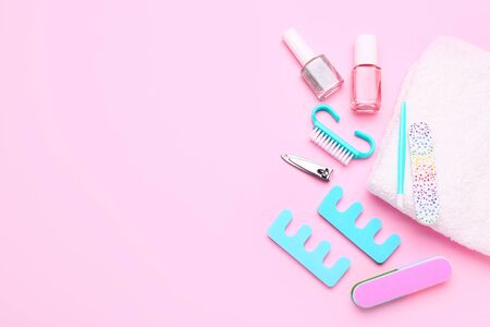 Pedicure set on light pink backgroundの写真素材