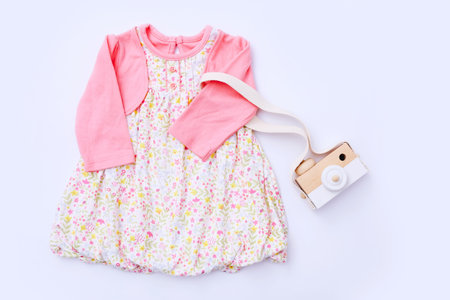 Top view fashion trendy look of baby girl clothes and toy stuff. Baby fashion conceptの写真素材