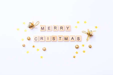Merry Christmas. Wooden letters with different decorations on white background. Flat lay. Top viewの写真素材