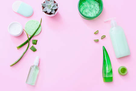 Aloe vera cosmetic products. Natural herbal skincare products on pink background. Top viewの写真素材