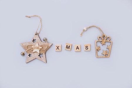 Wooden Christmas decorations on gray background, top viewの写真素材