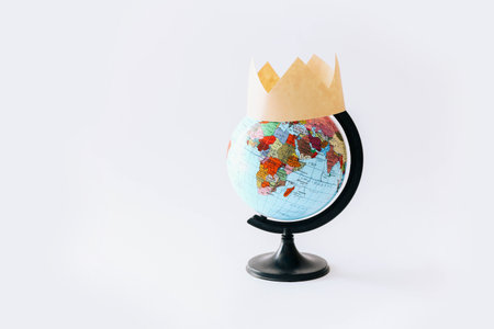Concept of Covid 19. One globe with crown on it, light background.