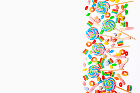 Mixed collection of colorful candy, on white background. Flat lay, top viewの写真素材