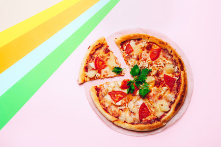 sliced pizza on a colored background. Top viewの写真素材