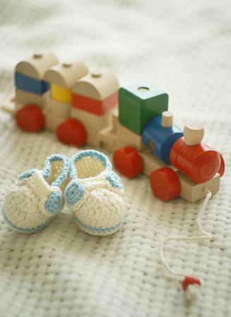 Toy train and tiny shoesの写真素材