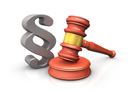 The judge hammer with a paragraph, isolated on white background.の写真素材