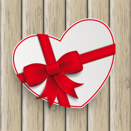 White paper heart with red ribbon the wooden background.のイラスト素材