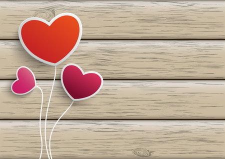3 hearts on the wooden background.のイラスト素材