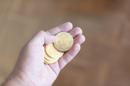 Golden bitcoin in the hand.の写真素材